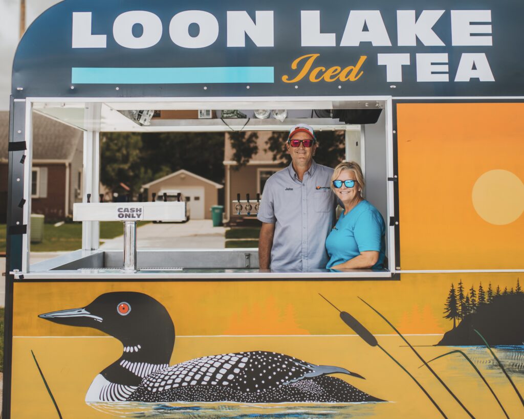 John Gotz and Kelly Miller in their Loon Lake Iced Tea booth.