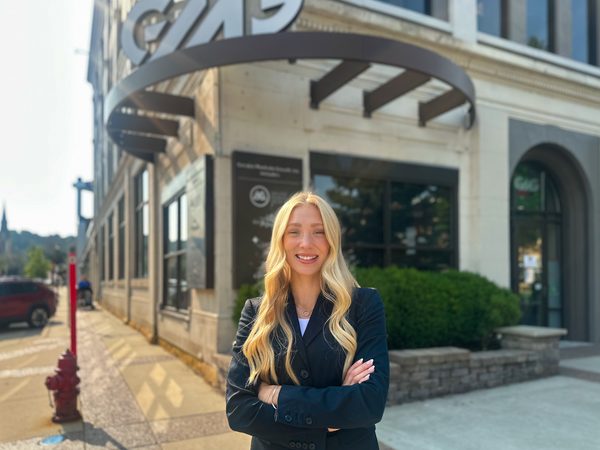 Elsa-Marie Landherr in front of the GMG Inc. offices.