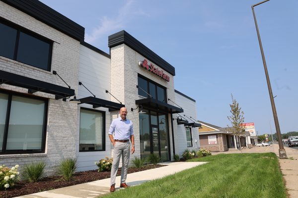 Aaron Hatanpa outside his building