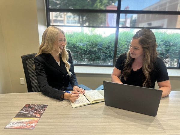 Elsa meeting with Visit Mankato's Joelle Baumann in the GMG Inc conference room.