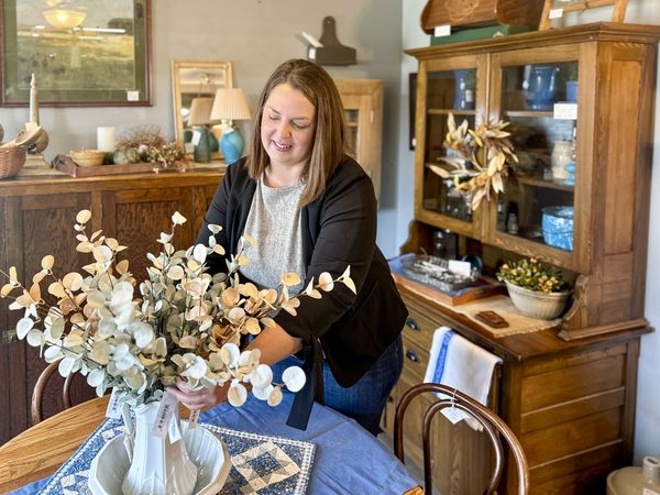 Cheryl Hamond staging decor at her store